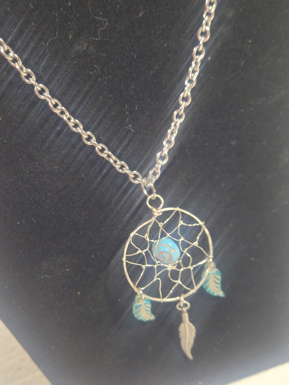 Handcrafted Silver Dreamcatcher Pendant With Blue Bead And Feather Charms